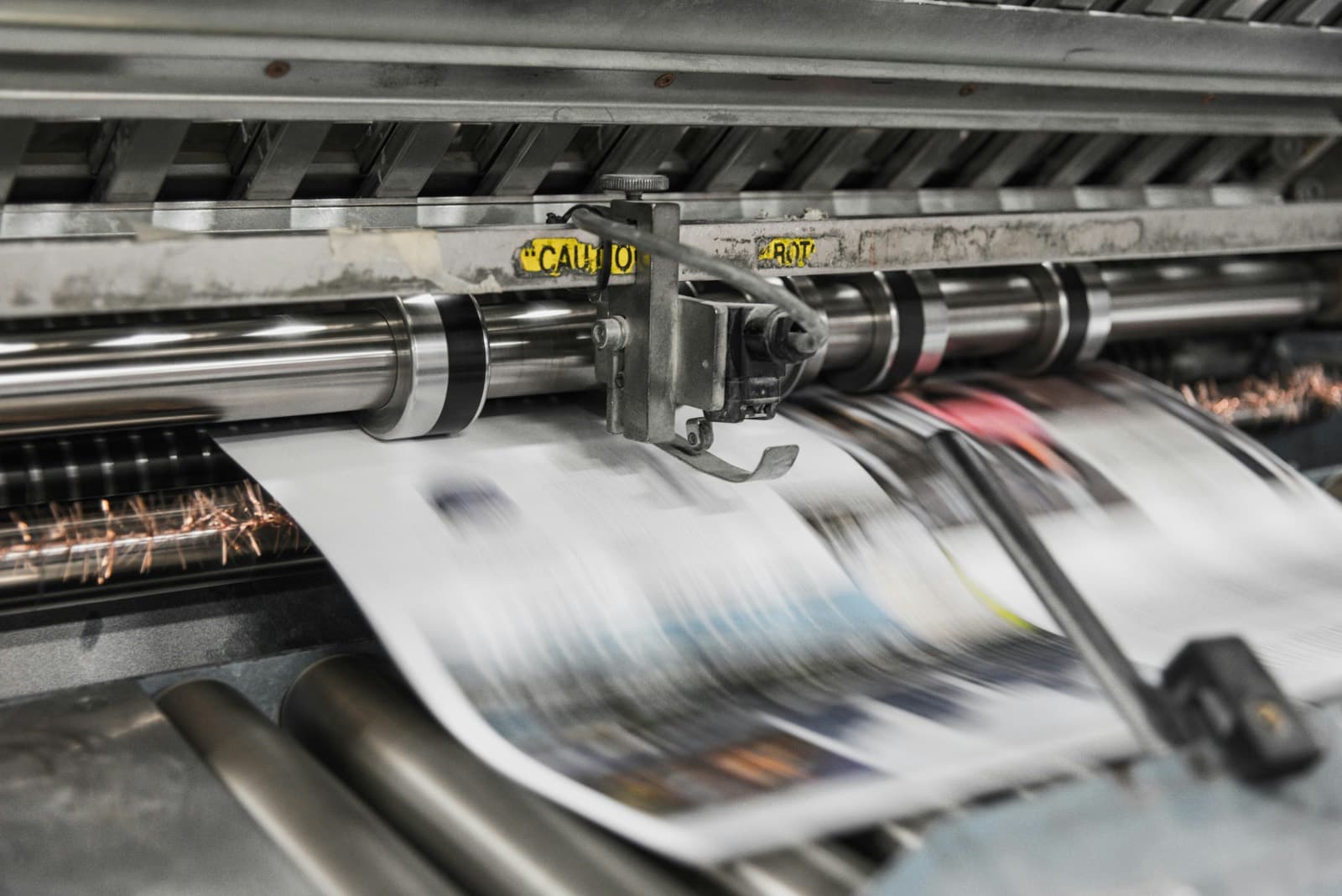 Printed sheets running through a press